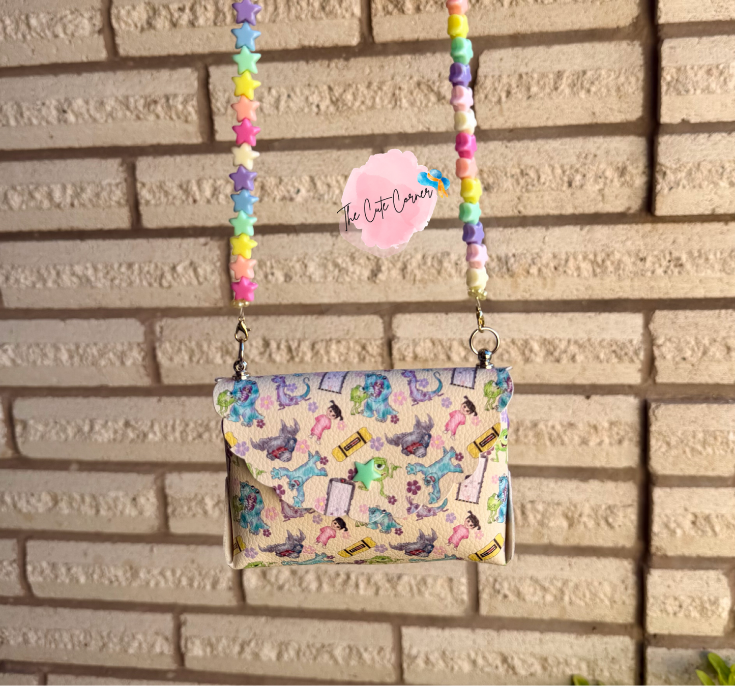 BEIGE MONSTER INC PURSE