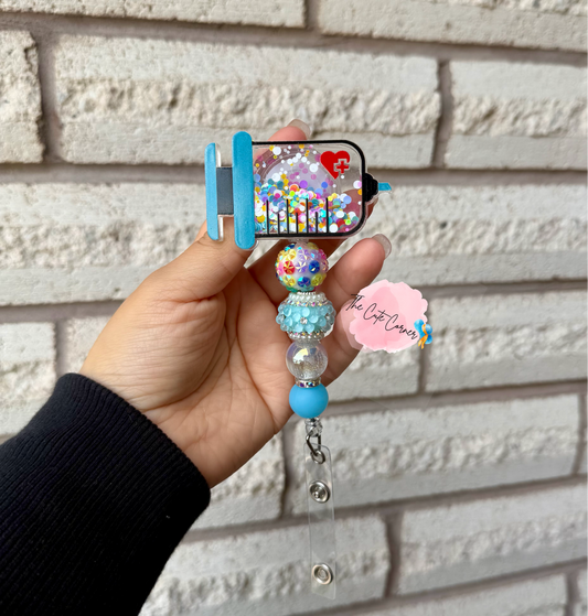 SYRINGE SHAKER BADGE REEL
